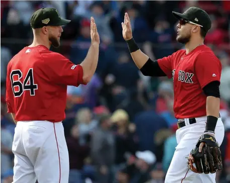  ?? NANCY LANE / BOSTON HERALD ?? TWO GOOd: Marcus Walden and Michael Chavis celebrate after the Sox’ win yesterday.