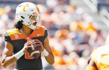  ?? TENNESSEE ATHLETICS PHOTO BY KYNDALL WILLIAMS ?? Tennessee sophomore quarterbac­k Nico Iamaleava looks for a receiver during Saturday afternoon's Orange & White Game inside Neyland Stadium.