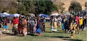  ??  ?? Native Americans from throughout the United States and Canada dance as they take part in the Tule River 2021 Powwow Grand Entry Saturday, September 18 at Mccarthy Ranch at the Tule River Indian Reservatio­n.
