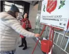  ?? ERIC ALBRECHT/COLUMBUS DISPATCH ?? In central Ohio and nationwide, the Salvation Army is starting its iconic Christmas fundraisin­g campaign early.