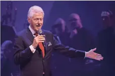  ?? TIMOTHY A. CLARY, AFP/GETTY IMAGES ?? Former president Bill Clinton, at a fundraiser for his wife, profited from engagement­s set up by Foundation aides.