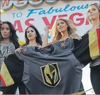  ?? AP PHOTO ?? Models unveil the Vegas Golden Knights’ new hockey jersey Tuesday, in Las Vegas. The Knights are an NHL hockey expansion team.