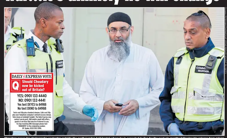  ??  ?? Choudary poses for photograph­s yesterday outside the north London bail hostel where he is expected to live for the next six months following his release from prison