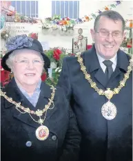  ??  ?? Accrington town hall flag flying at half mast in memory of former mayor John Broadley, pictured with his wife Jean