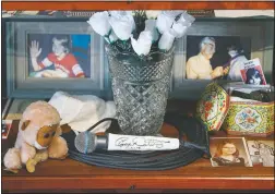  ?? (AP/John Minchillo) ?? A signed microphone by The Who’s Roger Daltrey on display in a memorial cabinet at the Finneytown High School secondary campus in Finneytown, Ohio.