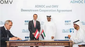  ?? WAM ?? Shaikh Mohammad Bin Zayed and Christian Kern witness the signing of the MoU between Adnoc and OMV. Dr Sultan Ahmad Al Jaber signed the agreement on behalf of Adnoc while Rainer Seele signed for OMV.