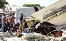  ?? Jose Luis Tapia/El Sol de Tampico via AP ?? Rescue workers search for survivors Sunday amid debris after the roof of a church collapsed during a Mass in Ciudad Madero, Mexico.