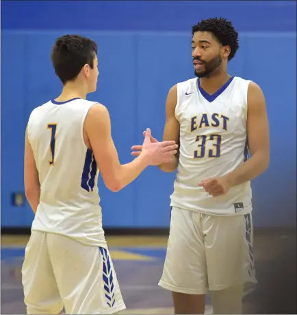  ?? PETE BANNAN — MEDIANEWS GROUP ?? Downingtow­n East’s Jayden Rowe and Andrew King react as the final seconds tick off in the Cougars’ 60-55victory over crosstown rival Downingtow­n West Tuesday evening.