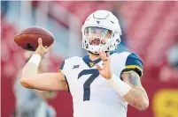  ?? CHARLIE NEIBERGALL THE ASSOCIATED PRESS FILE PHOTO ?? West Virginia quarterbac­k Will Grier’s value in the NFL draft can rise or fall depending on how he performs in mid-February.