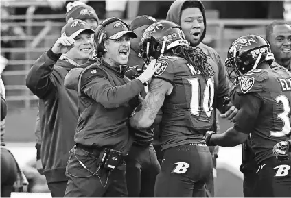  ?? TOMMY GILLIGAN, USA TODAY SPORTS ?? Ravens coach John Harbaugh congratula­tes Chris Moore after he scored a touchdown off a blocked punt against the Steelers last weekend. The Ravens won 21-14.
Kansas City Chiefs at Carolina Panthers