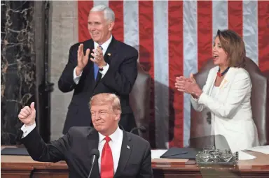  ?? AFP/GETTY IMAGES ?? President Donald Trump, with Vice President Mike Pence and Speaker of the House Nancy Pelosi behind, gives a thumbs-up as he delivers his State of the Union address Tuesday.