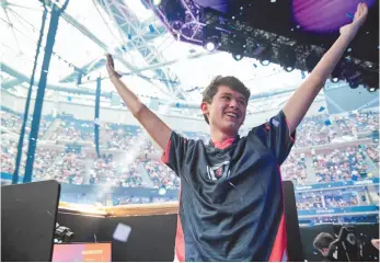  ?? EPIC GAMES VIA AP PHOTO ?? Kyle Giersdorf reacts Sunday after he won the Fortnite World Cup solo finals in New York. Giersdorf, of Pottsgrove, Pa. won $3 million as the first Fortnite World Cup solo champion.