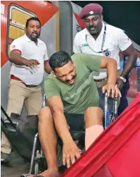  ?? ?? An injured victim being wheeled out by railway officials at MGR Central station in Chennai on Sunday