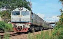  ?? DARREN WOOD ?? The electrific­ation will replace diesel loco hauled trains. KTM Class 24 diesel No. 24121 is seen at Labis between Gemas and Johor Bahru on July 9, 2013. The 26 Class 24 locomotive­s which incorporat­e a 2400hp Pielstick SP16 PA4V 200VG engine were all built in 1987 by Toshiba in Japan.