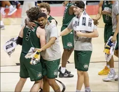  ?? DOUG MCSCHOOLER — THE ASSOCIATED PRESS ?? Ohio players celebrate after defeating Virginia on Saturday in Bloomingto­n, Ind.