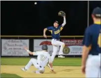  ?? SAM STEWART - DIGITAL FIRST MEDIA ?? Pope John Paul II shortstop Cole Narciso goes up in the air to try and catch an overthrown ball from the catcher as Jake Kelchner slides into second.