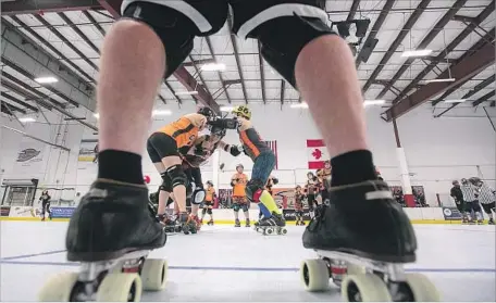  ?? Photograph­s by Scott Smeltzer Daily Pilot ?? MEMBERS OF THE Orange County Roller Derby league practice at The Rinks in Huntington Beach in September.