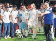  ?? PTI ?? Union Home Minister Rajnath Singh and Sports Minister Vijay Goel kick footballs as wrestler Sushil Kumar (left) looks on.