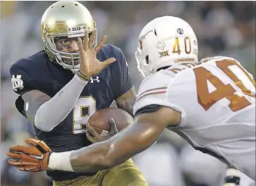  ?? Nam Y. Huh Associated Press ?? NOTRE DAME QUARTERBAC­K Malik Zaire runs with the ball against Texas defensive end Naashon Hughes during the Fighting Irish’s opener last season. Zaire suffered a season-ending injury in the next game.