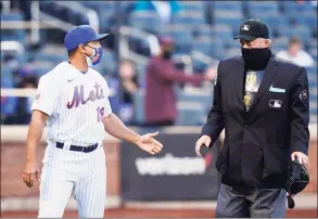  ?? Frank Franklin II / Associated Press ?? New York Mets manager Luis Rojas talks to home plate umpire Joe West after Michael Conforto was hit by a pitch during the sixth inning against the Philadelph­ia Phillies in the first game of a doublehead­er on Tuesday.