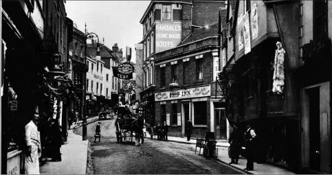  ?? ?? Above, a view of Gabriel’s Hill from around 1910, showing the Golden Boot next to the Ship Inn. Right, the iconic sign is taken down for refurbishm­ent in 1997