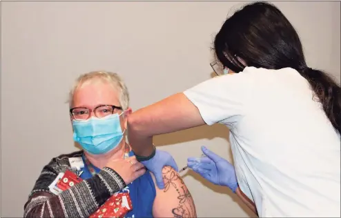  ?? Sharon Hospital / Contribute­d photo ?? A Sharon Hospital staff member receives the COVID-19 vaccine.