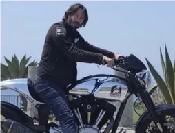  ?? ADAM WOLFFBRAND­T/BLOOMBERG ?? Keanu Reeves and motorcycle designer Gard Hollinger co-founded Arch Motorcycle Company, which builds custom KRGT-1 bikes in Hawthorne, Calif.