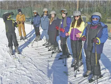  ?? BY ROGER PIERSON ?? Several of the newer Boy Scout and Venture Crew skiers readying themselves for their initial lesson before heading to the lifts for an excellent day and evening on the slopes.