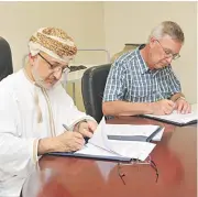  ?? (Muscat Daily) ?? H E Salem al Mahrouqi and Beda Hofmann sign the pact