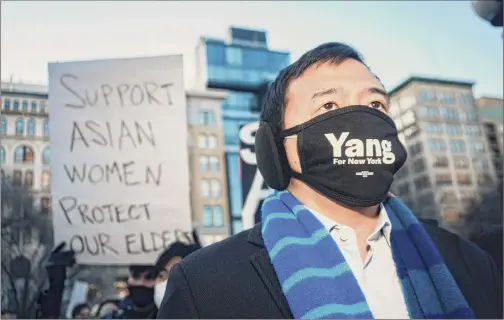  ?? Jutharat Pinyodoony­achet / New York Times ?? Andrew Yang attends a New York vigil last week supporting the Asian American community following the Atlanta shootings. Yang is seeking to become the city’s first Asian American mayor, but critics say some of his past comments have fed racial stereotype­s.