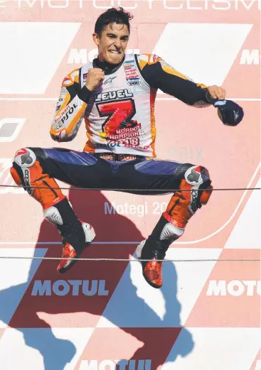  ?? Picture: MARTIN BUREAU/AFP ?? ON HIGH: Marc Marquez celebrates his MotoGP Japanese Grand Prix victory.