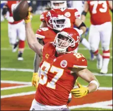  ?? Associated Press ?? SCORE — Kansas City Chiefs tight end Travis Kelce spikes the ball after scoring a touchdown against the Buffalo Bills during the NFL AFC championsh­ip game on Jan. 24 in Kansas City, Mo.