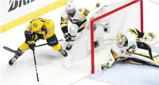  ?? BRUCE BENNETT/GETTY IMAGES ?? Nashville Predators centre Frederick Gaudreau scores a goal against Pittsburgh Penguins goaltender Matt Murray during Game 4 of the Stanley Cup final on Monday in Nashville, Tenn.