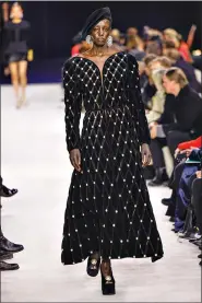  ?? (Vianney Le Caer/Invision/AP) ?? A model wears a creation as part of the Balmain Fall/Winter 20232024 ready-to-wear collection presented Wednesday, March 1, 2023 in Paris.