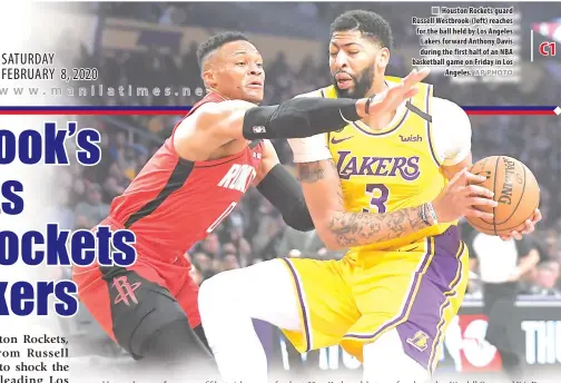  ?? AP PHOTO ?? Houston Rockets guard Russell Westbrook (left) reaches for the ball held by Los Angeles Lakers forward Anthony Davis during the first half of an NBA basketball game on Friday in Los Angeles.