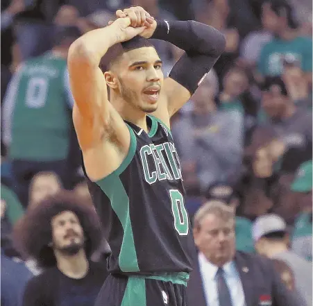  ?? STAFF PHOTO BY MATT STONE ?? NO GOOD: Jayson Tatum reacts after missing a last-ditch 3-pointer, sealing the Celts' double-overtime loss to the Wizards last night at the Garden.