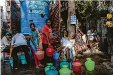  ?? Rebecca Conway / New York Times ?? Residents collect water delivered by a tanker June 24 in Chennai, India. A report by the World Resources Institute shows 17 countries, including India, now face extreme water shortages.