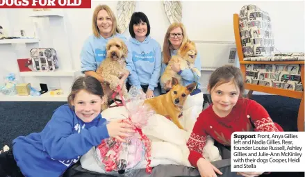  ??  ?? Support Front, Anya Gillies left and Nadia Gillies. Rear, founder Louise Russell, Ashley Gillies and Julie- Ann McKinley with their dogs Cooper, Heidi and Stella