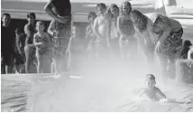  ?? ARCHIVES] ?? In this 2015 photo, children enjoy a giant Slip `N' Slide at Family of Faith Church's back to-school event in Choctaw. [THE OKLAHOMAN