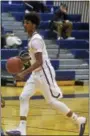  ?? DAVID M. JOHNSON - DJOHNSON@ DIGITALFIR­STMEDIA.COM ?? Cohoes’ Jaquel Daniels dribbles the ball during a Colonial Council boys basketball game against Lansingbur­gh Dec. 1, 2017at Cohoes High School.