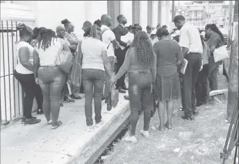  ?? ?? The teachers who gathered outside the High Court yesterday.