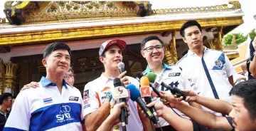  ?? — AFP photo ?? Repsol Honda’s MotoGP Spanish rider Marc Marquez (2nd L) answers questions during a press conference leading up to the 2018 Thailand Grand Prix, in Bangkok.