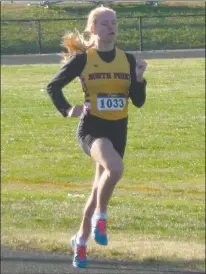  ?? STAFF PHOTO BY ANDY STATES ?? North Point’s Rachel Nueslein runs to the finish in the girls 1,600 during Tuesday’s track and field quad-meet at Great Mills. Nueslein won the girls race in 5 minutes 23.3 seconds.