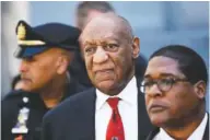  ?? THE ASSOCIATED PRESS ?? Bill Cosby, center, leaves the Montgomery County Courthouse in Norristown, Pa., after being convicted Thursday of drugging and molesting a woman.