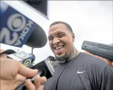  ??  ?? Maurkice Pouncey laughs while taking questions from the media Wednesday. The Steelers center insisted neither he nor his teammates have a problem with coach Mike Tomlin playing favorites. “The world treats everyone differentl­y,” he said.