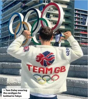  ??  ?? Tom Daley wearing the cardigan he knitted in Tokyo