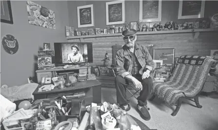  ?? TIM JOHNSON/COLUMBUS MONTHLY ?? Frederick C. Peerenboom, better known as Fritz the Nite Owl, surrounded by movie memorabili­a in his basement.