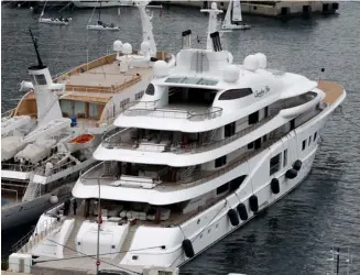  ?? VALERY HACHE/AGENCE FRANCE-PRESSE ?? THE ‘Quantum Blue’ (right), Russian billionair­e Sergei Galitsky’s yacht, is docked in the port of Monaco as a mega-yacht owned by a company linked to the head of Russian oil giant Rosneft has been seized in southern France.