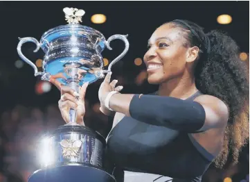  ??  ?? Serena Williams of the US holds her Australian Open trophy after winning her women’s singles final against sister Venus Melbourne Park, Melbourne in Australia, in this January 28, 2017 file photo. — Reuters photo