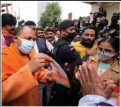  ?? (AP/Rajesh Kumar Singh) ?? Adityanath campaigns door to door Saturday for upcoming state assembly elections in Gorakhpur, India.